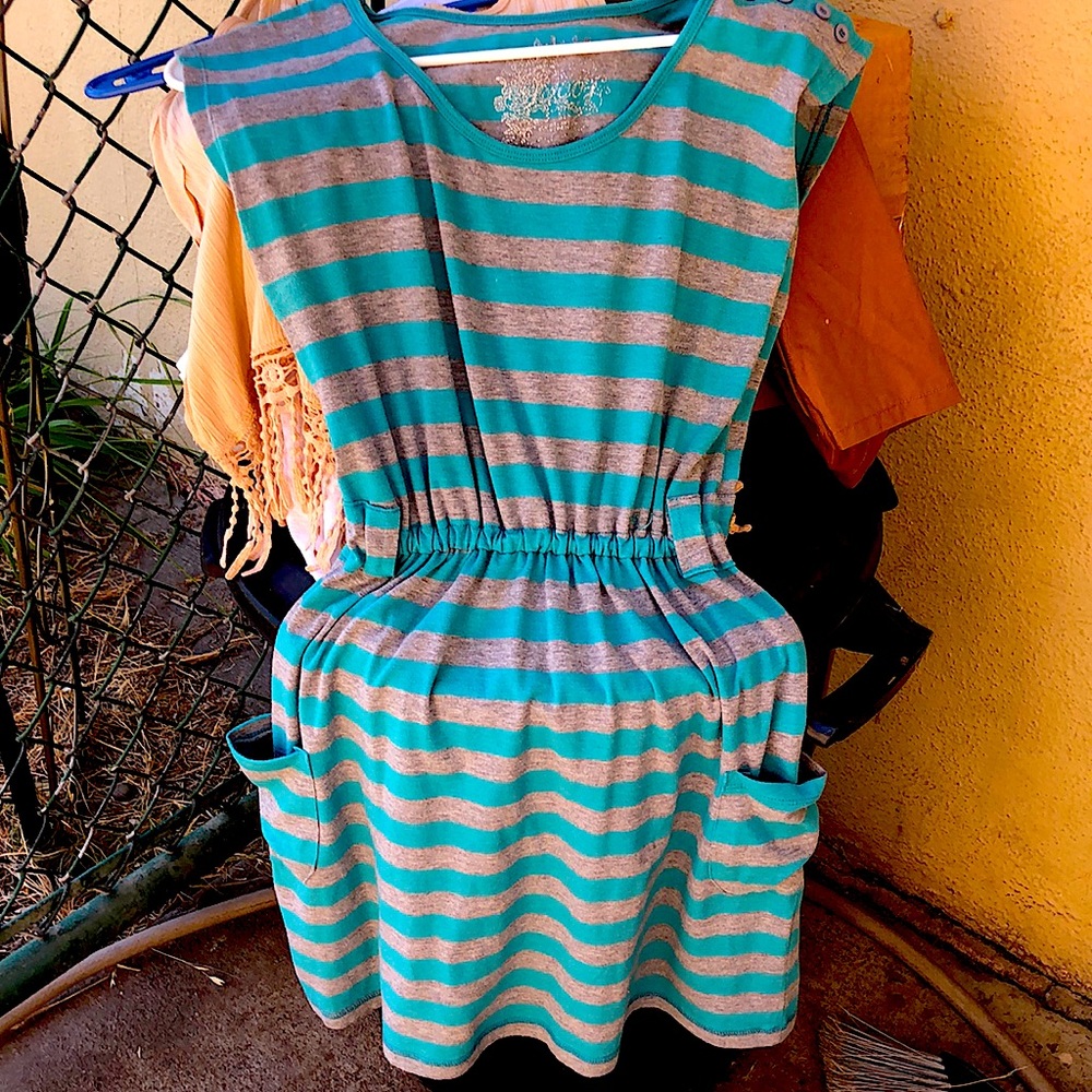 Casual fit gray and teal stripped sleeveless dress with pockets.